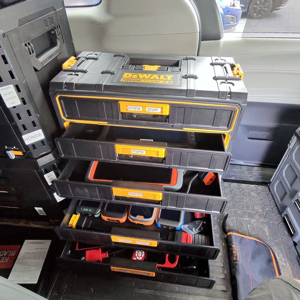 Key programmers and equipment sorted by vehicle make in the service van