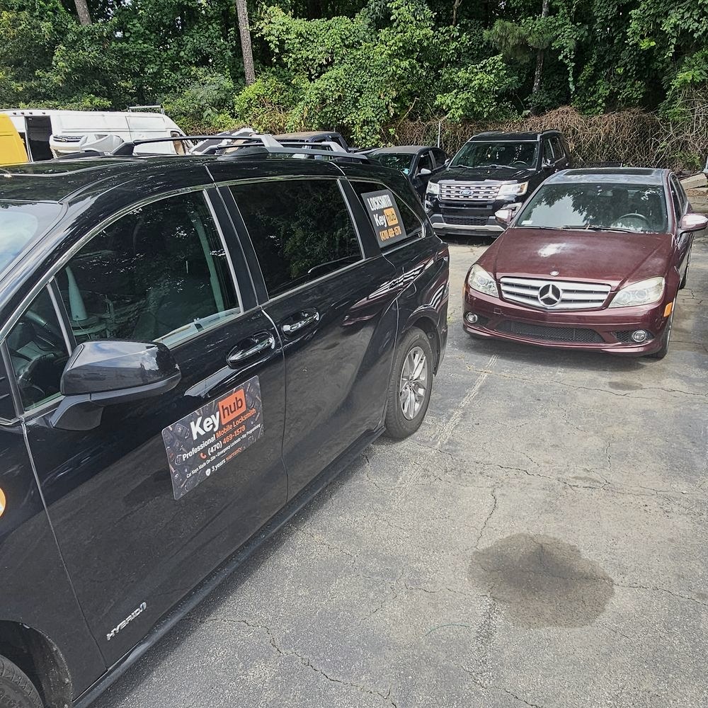 Keyhub mobile locksmith van parked next to a customer's Mercedes in Metro Atlanta
