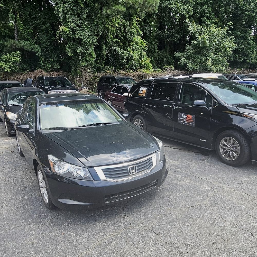 Keyhub van on a car key job next to a Honda Accord